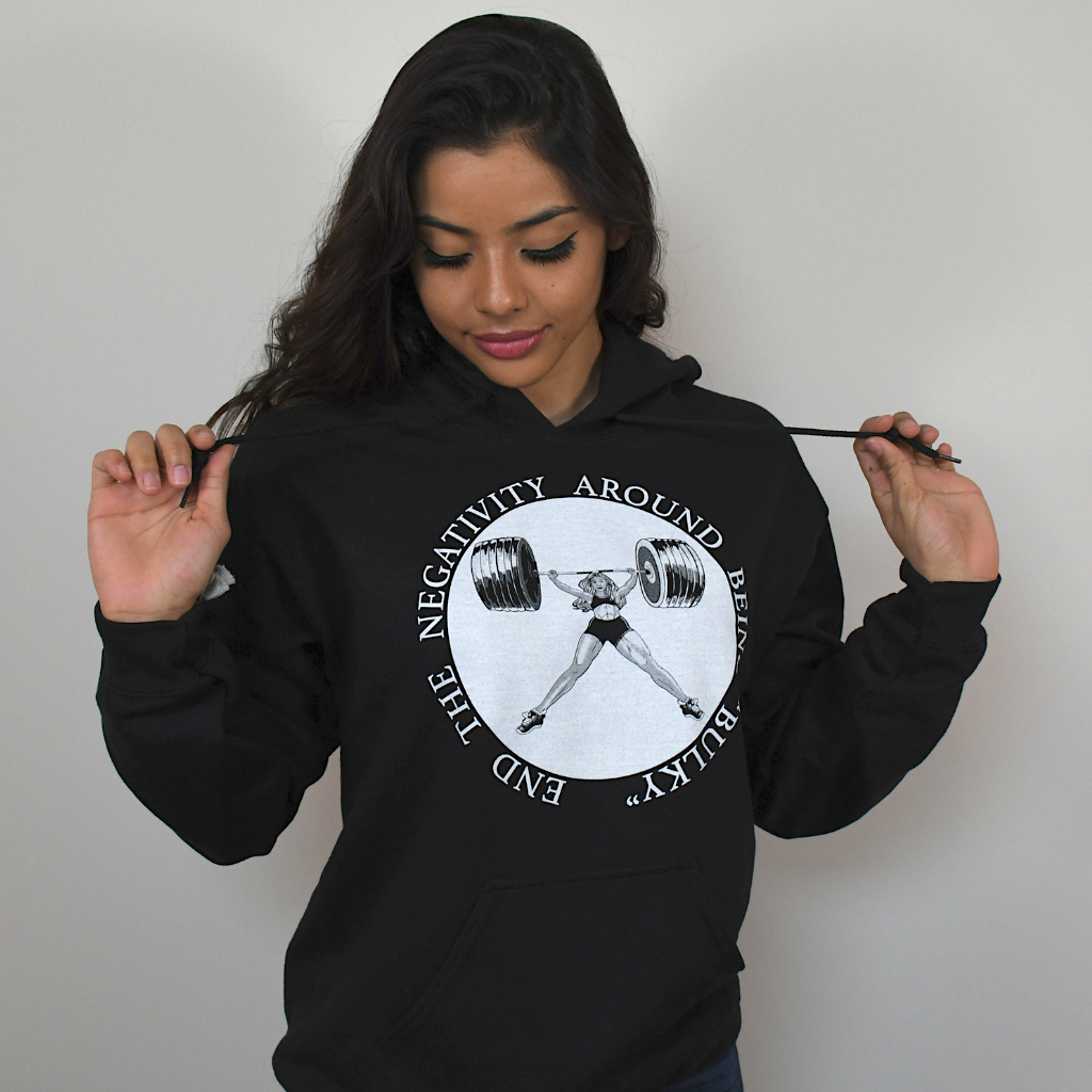 Main photo of Model wearing Black Hoodie with white graphic of a women power lifter