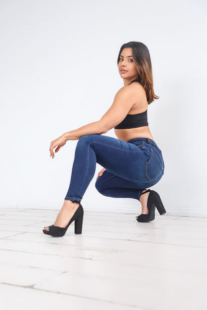 Alicia squatting down in the Power Jeans. The Power Jeans are made for the athletic body fitting your hips, thighs, and waist. Alicia is 5'3 with a 29 inch waist, 38 inch hips, and is wearing a size 27.