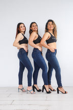 Group of 3 models wearing the Power Jeans posing to the side. The Power Jeans are made for the athletic body fitting the hips, quads, and waist.