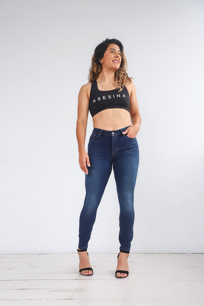 Bella wearing the Power Jeans posing to the front. The Power Jeans are made for the athletic body fitting your hips, thighs, and waist. Bella is 5'7 with a 31 inch waist, 42 inch hips, and is wearing a size 29.