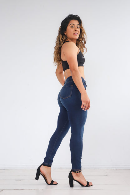 Bella wearing the Power Jeans posing to the side. The Power Jeans are made for the athletic body fitting your hips, thighs, and waist. Bella is 5'7 with a 31 inch waist, 42 inch hips, and is wearing a size 29.